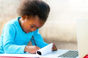 A young Kenyan girl learning- edutainment